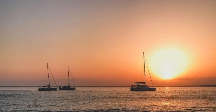Lanzarote: Dolphin-Watching Sunset Cruise with Transfers - The view game: Puerto del Carmen at sunset from open water