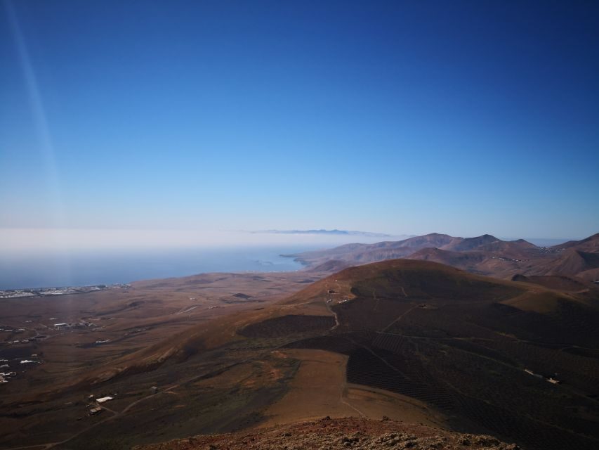 Lanzarote: La Geria Vineyards Hiking Tour - The 9-kilometer hike and the climb to top views