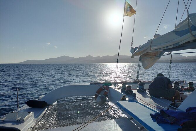 Small Group Dolphin Sunset Tour on Electric Catamaran Lanzarote - Where you’ll go: coastline views toward Playa Quemada and Femés