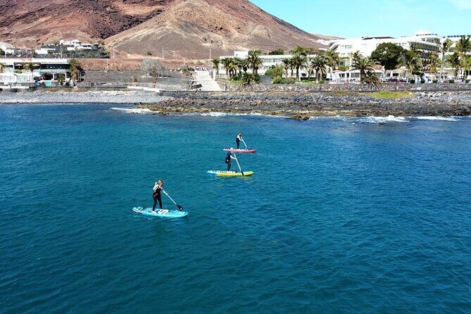 SUP Standup Paddling and Snorkeling Shared Experience - Before the water: wetsuit mask briefing and getting control of your board